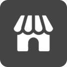 White storefront icon with striped awning on dark gray background, symbolizing a shop.